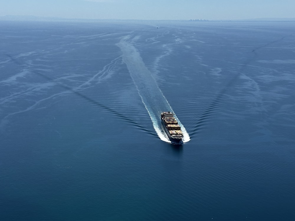 a large boat traveling across a large body of water