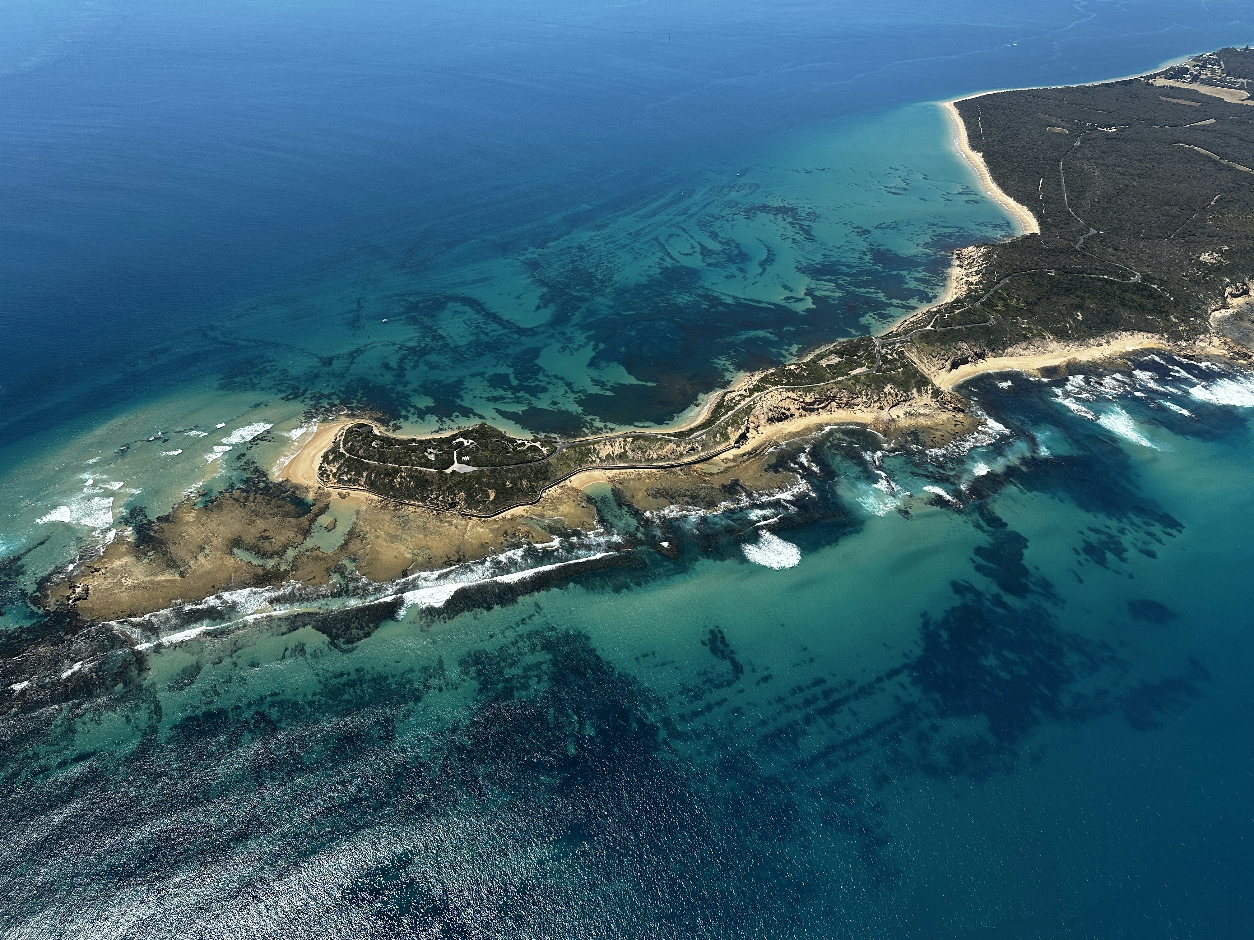 an aerial view of an island in the middle of the ocean