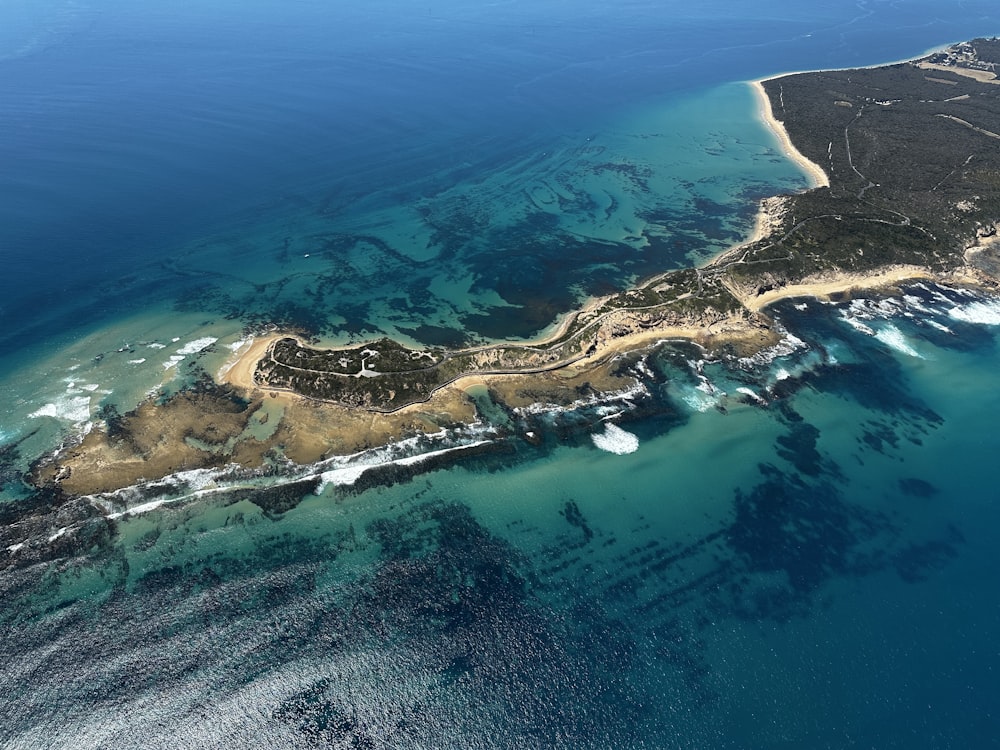 an aerial view of an island in the middle of the ocean