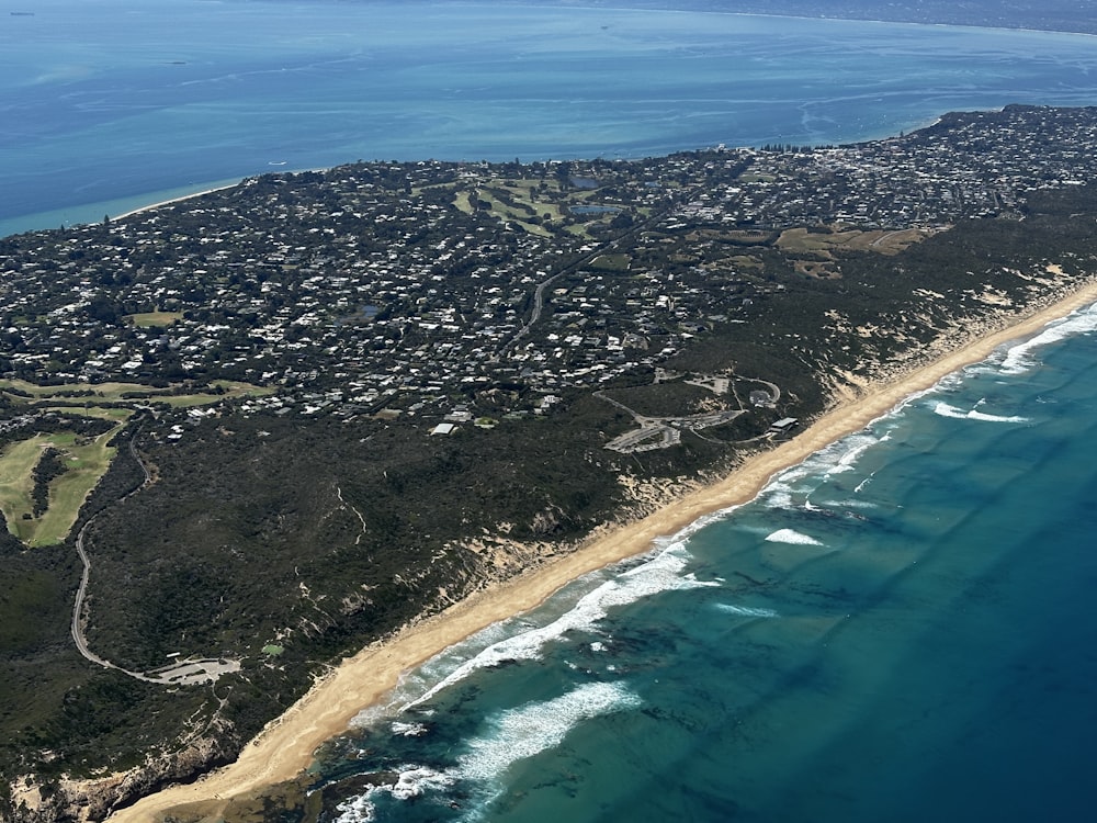 an aerial view of a beach and ocean