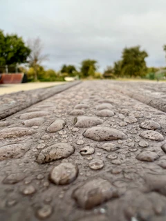 a close up of a street with rain drops on it