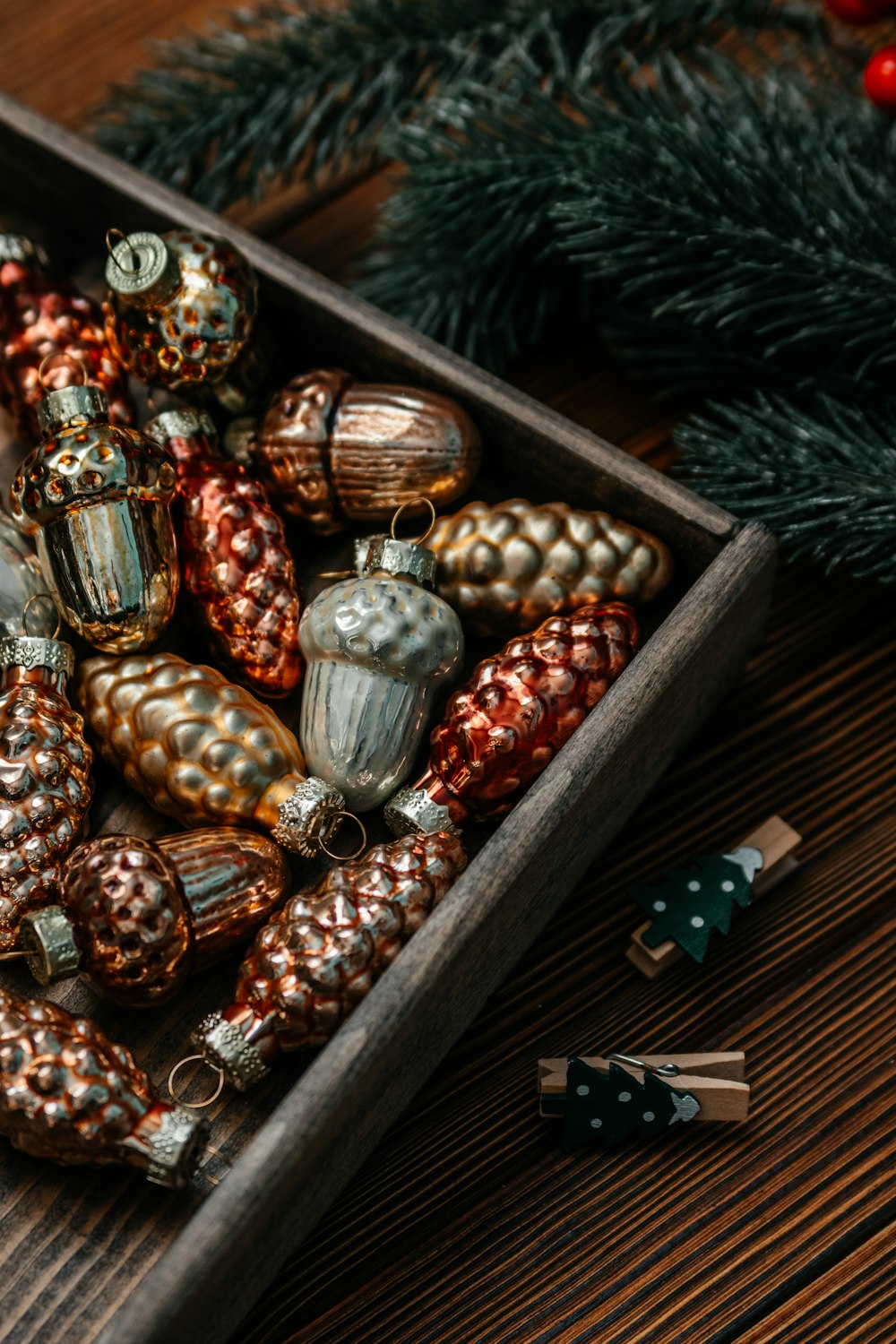 a wooden box filled with ornaments on top of a table
