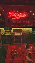 A cozy Mexican restaurant entrance with warm lighting and traditional decorations