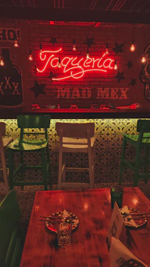 A cozy Mexican restaurant entrance with warm lighting and traditional decorations