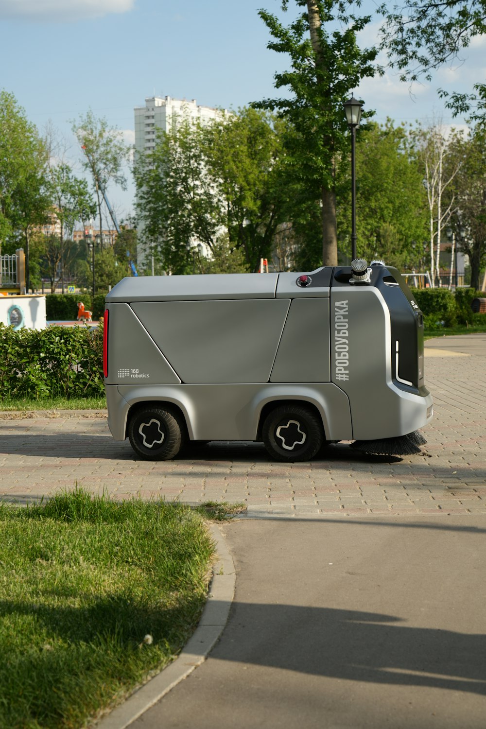 a silver vehicle parked on the side of a road