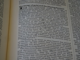 A modern depiction of scripture illuminated by light.