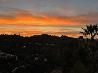Sunset casting warm hues over the tranquil hills of Tierras Tranquilas.