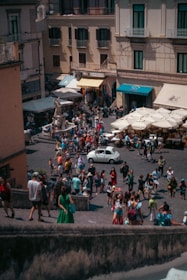 A bustling commercial plaza filled with shops and people.