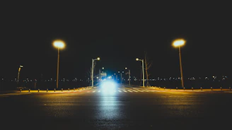 A friendly recovery driver assisting a stranded car on a quiet Croydon street at dusk.