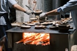 a man is cooking food on a grill