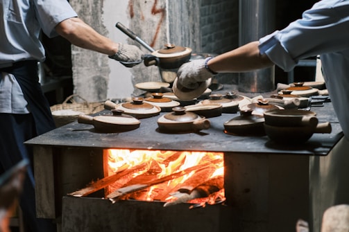 a man is cooking food on a grill