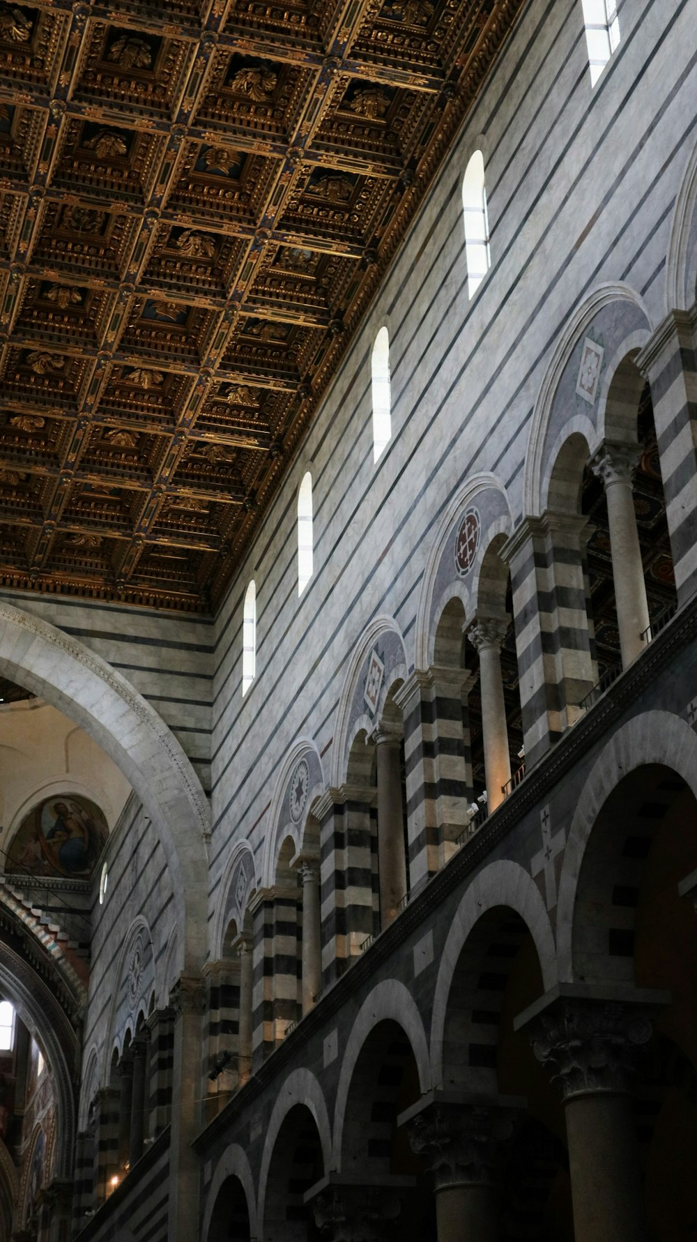 the ceiling of a building with arches and arches