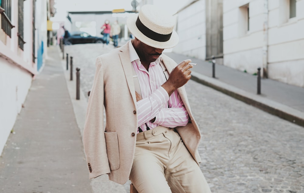 a man wearing a hat and a coat