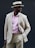 A happy man wearing a stylish outfit while shopping.