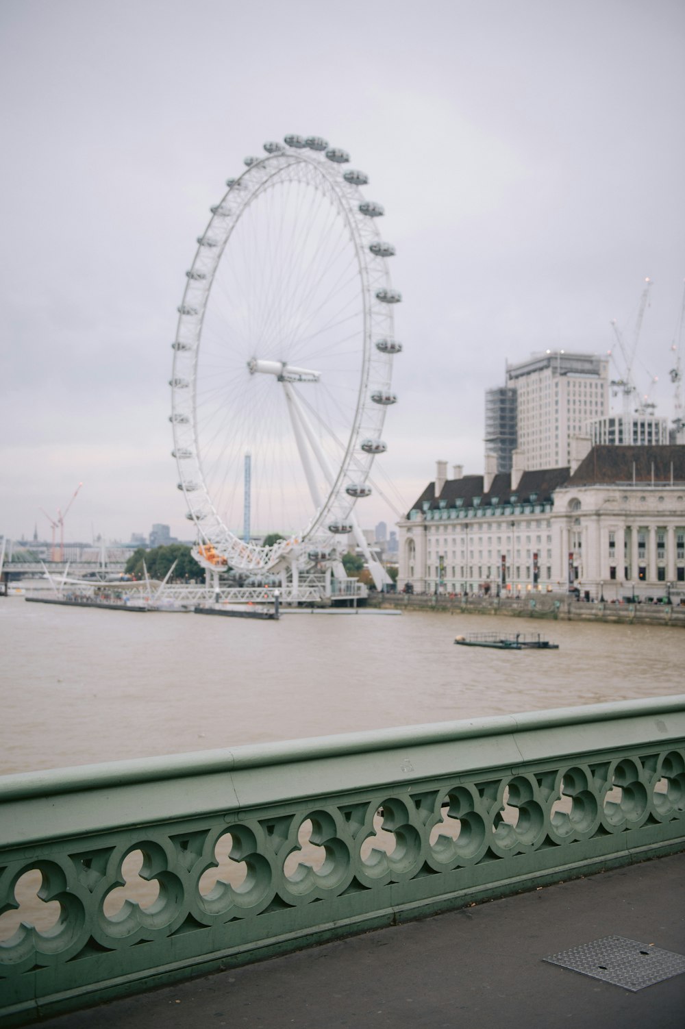 a view of a ferris wheel from a bridge