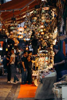 A bustling exotic market street lit by warm lanterns, capturing the essence of local culture.