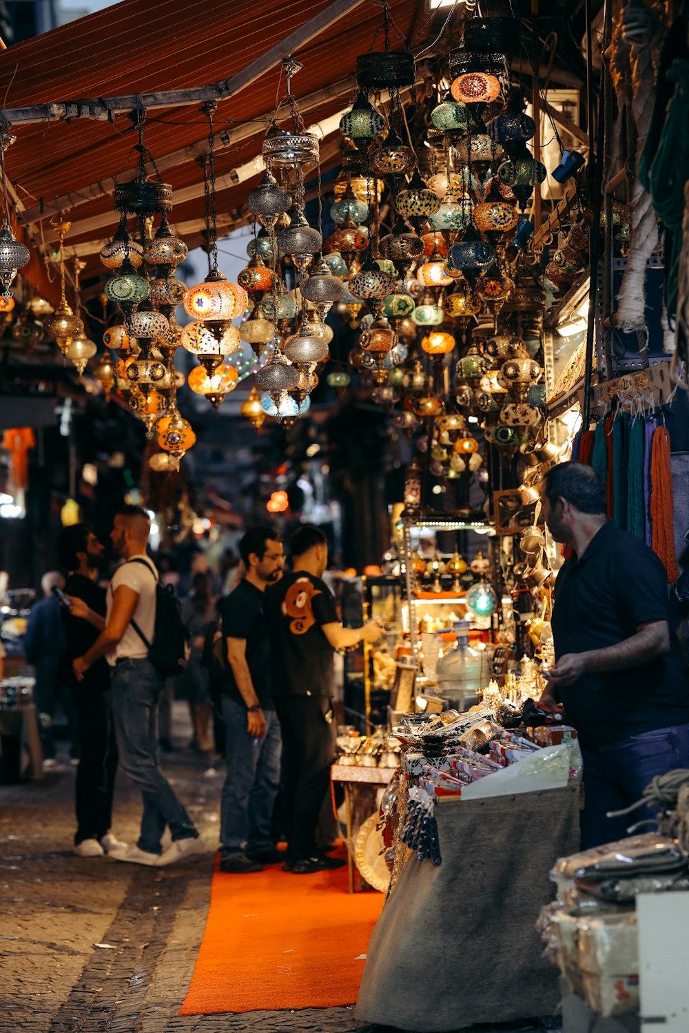 a group of people standing around a market