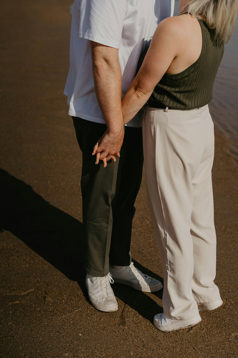 a man and a woman standing next to each other