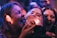 A vibrant photo of a group of friends laughing and posing in a photo booth.