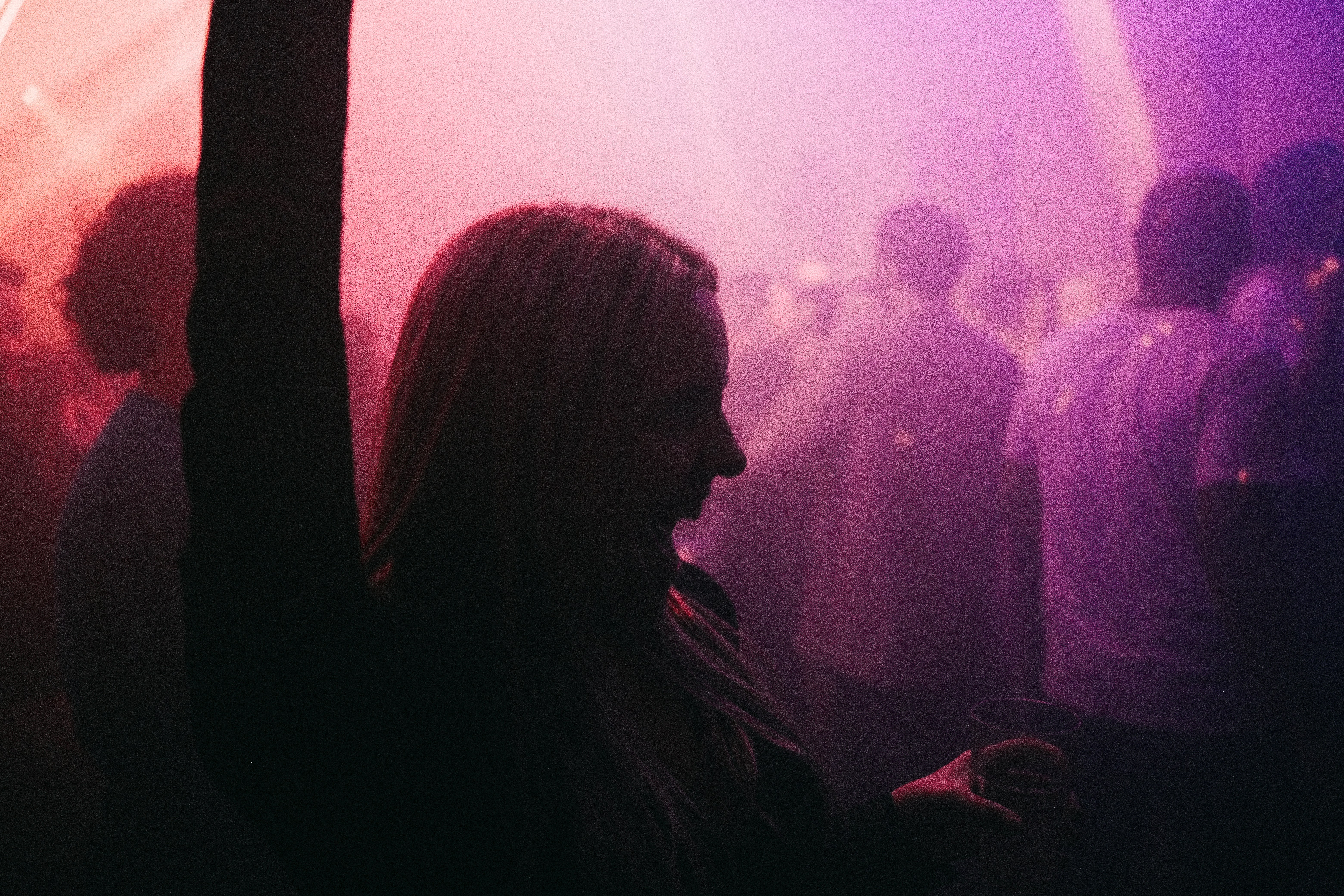 a woman standing in front of a crowd of people