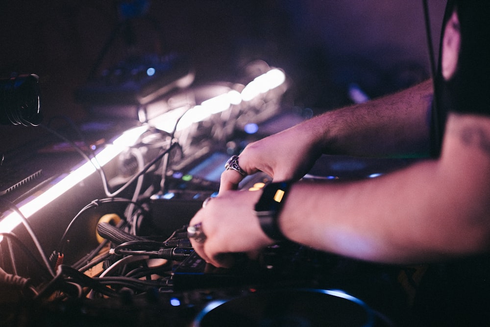 a dj mixing music in a dark room