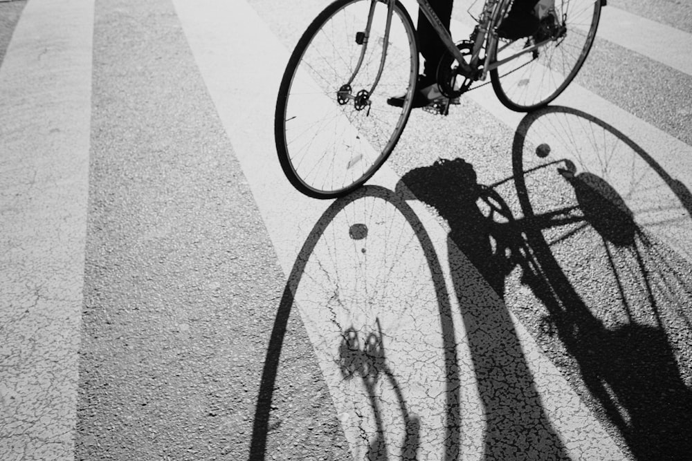 a person riding a bike down a street