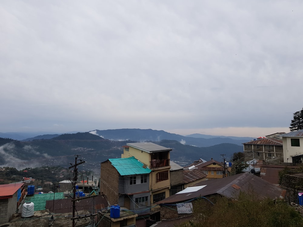 a view of a town with mountains in the background