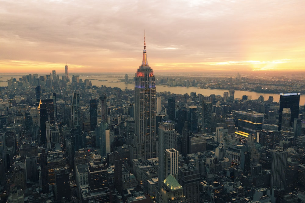 an aerial view of a city at sunset