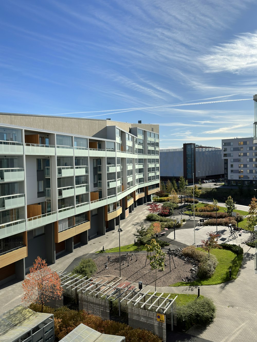 an aerial view of a building and a parking lot