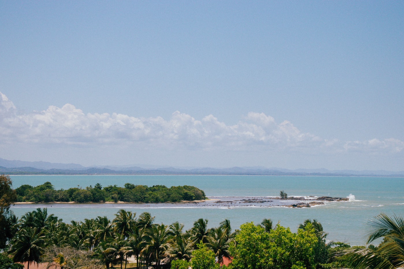 A scenic view of Kiribati's turquoise lagoon and palm-fringed shoreline