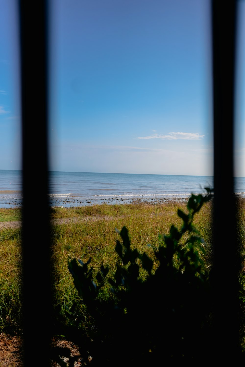 a view of a beach through a window