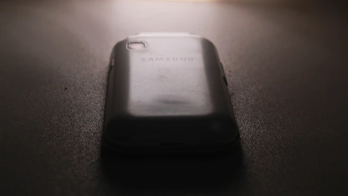 A Samsung phone with a brand-new battery installed, glowing with full charge.