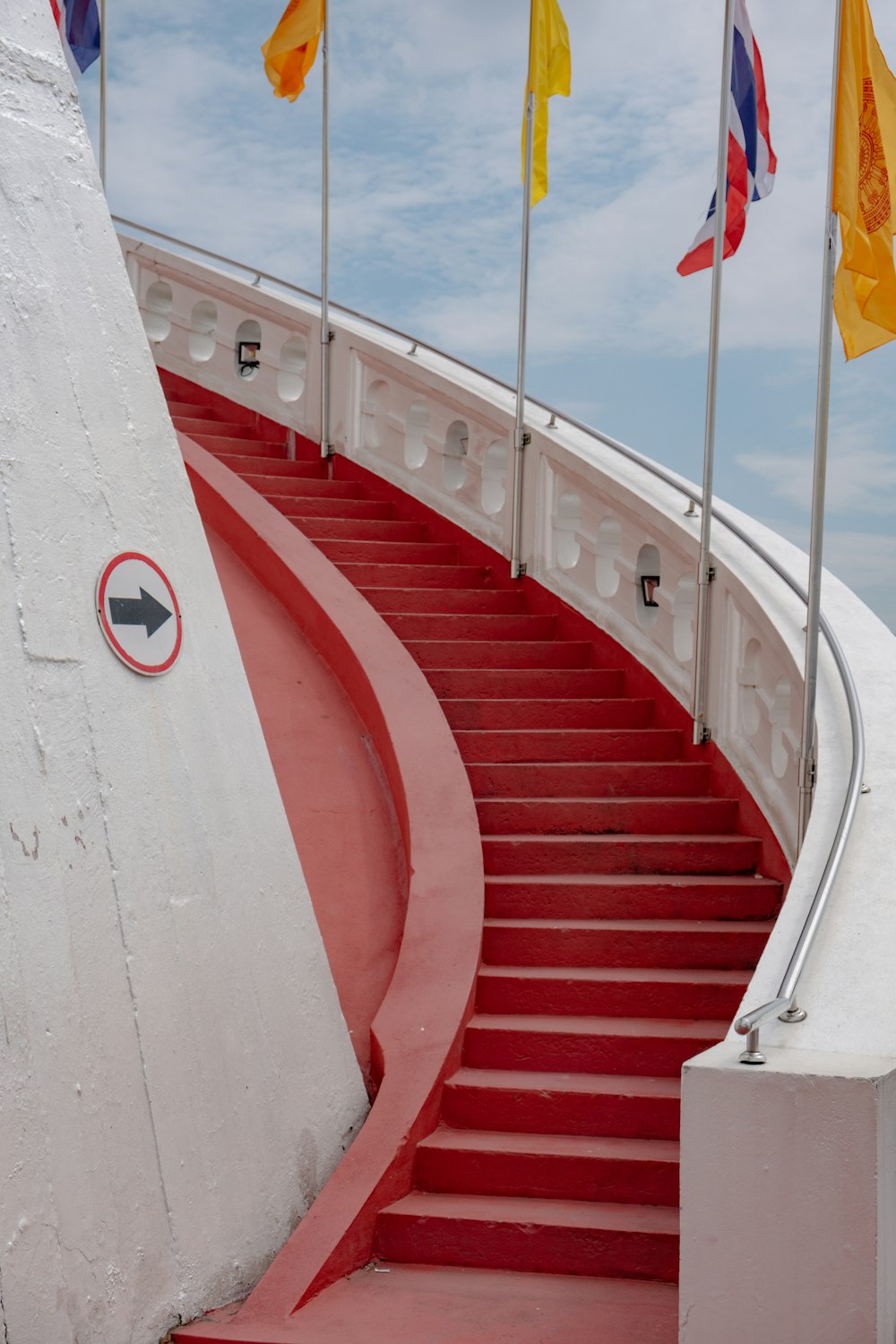 a set of red steps leading up to the top of a building