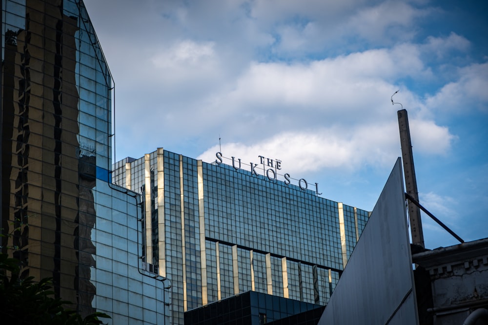 a tall building with a sign on top of it