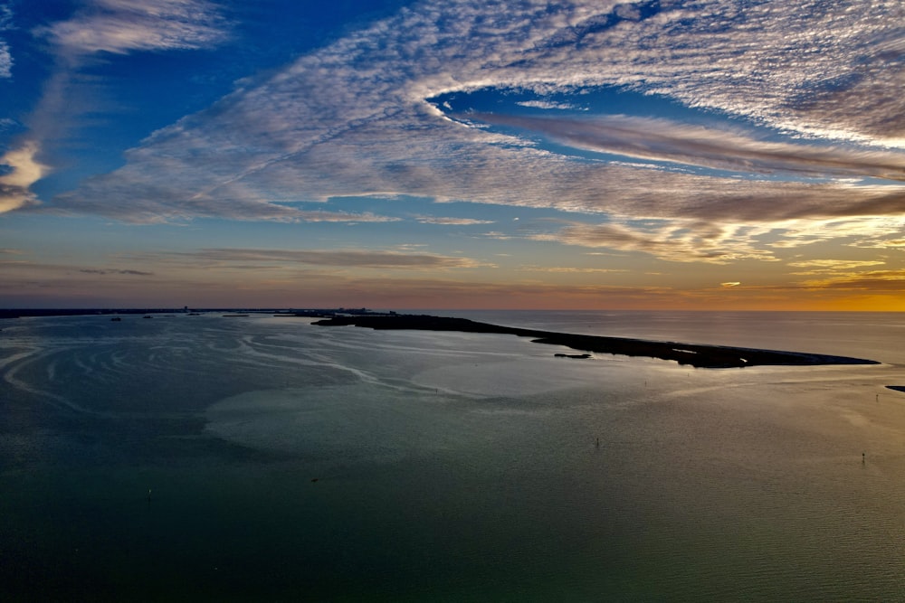 a view of a body of water at sunset