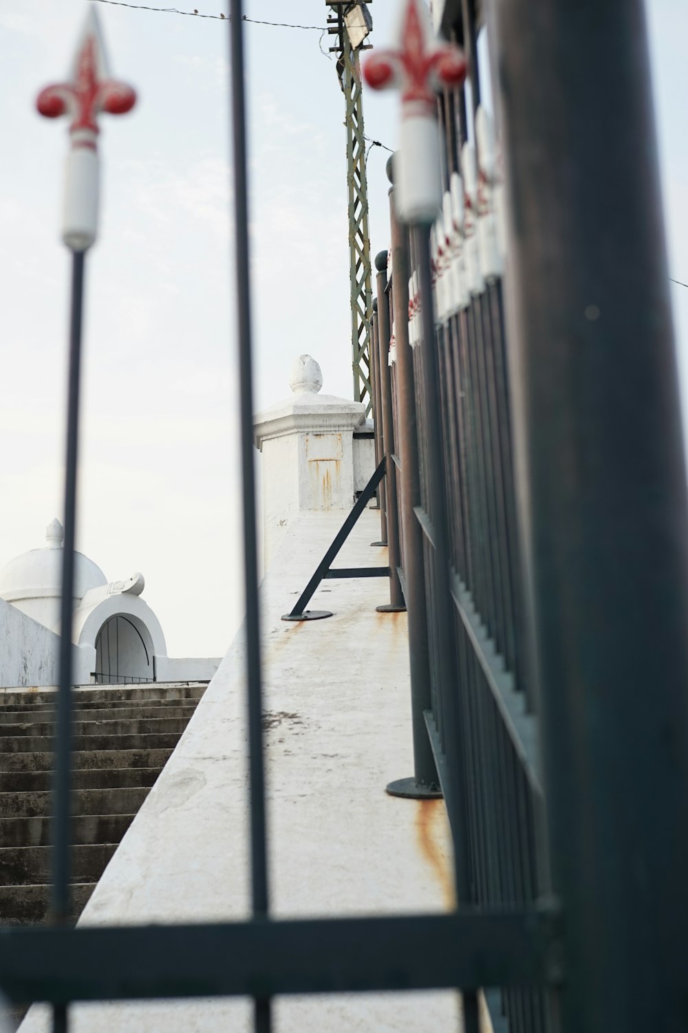 a view of a building through a fence