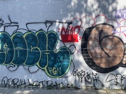 a wall with some graffiti on it