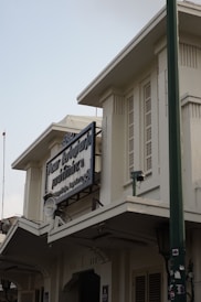 a white building with a sign on the front of it