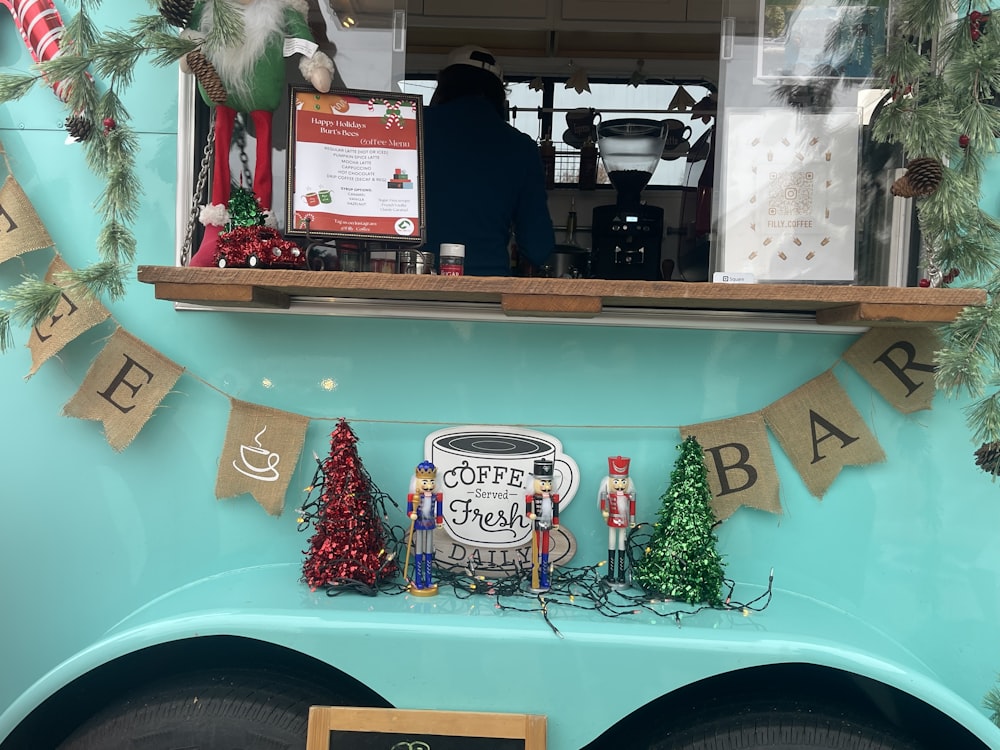 a coffee truck decorated for christmas with decorations