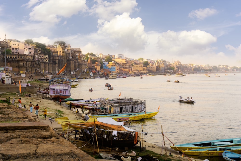 a group of boats sitting on top of a river