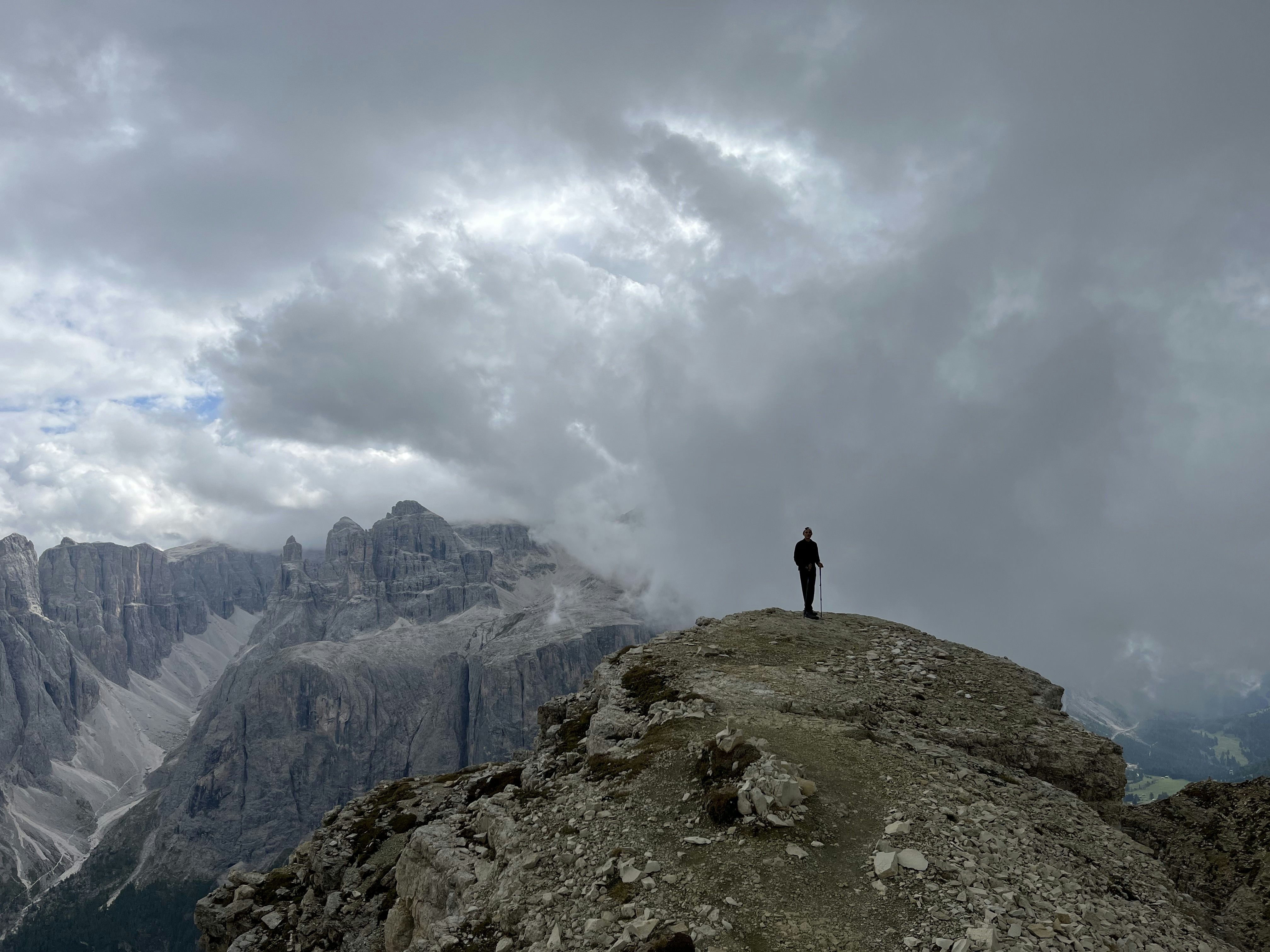 a person standing on top of a large rock