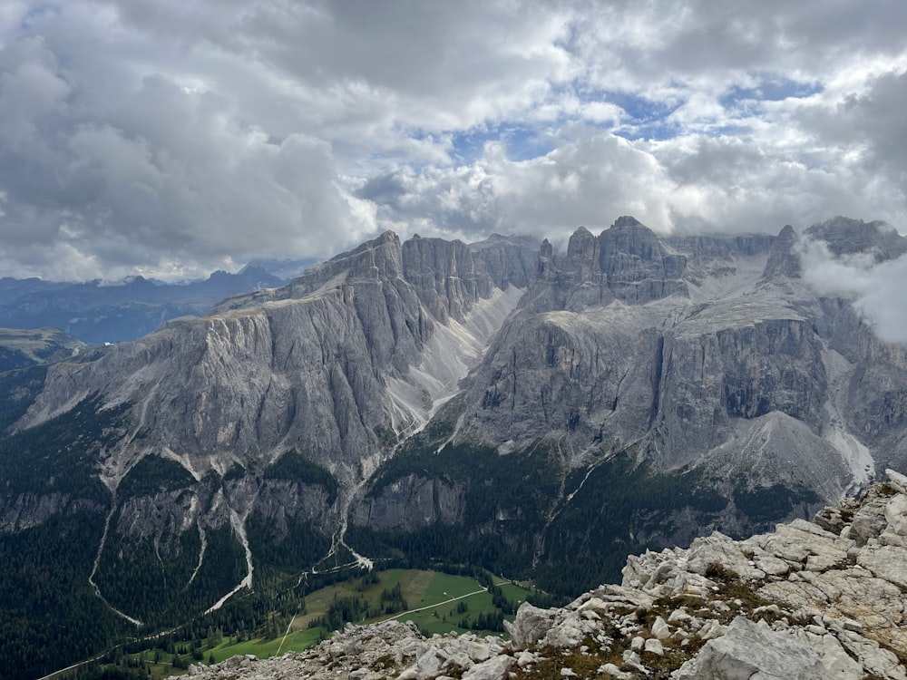 a view of a mountain range with clouds in the sky