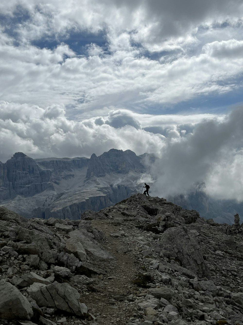 a person standing on top of a rocky mountain