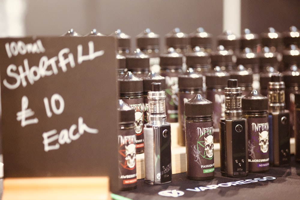 a table topped with lots of bottles of liquid