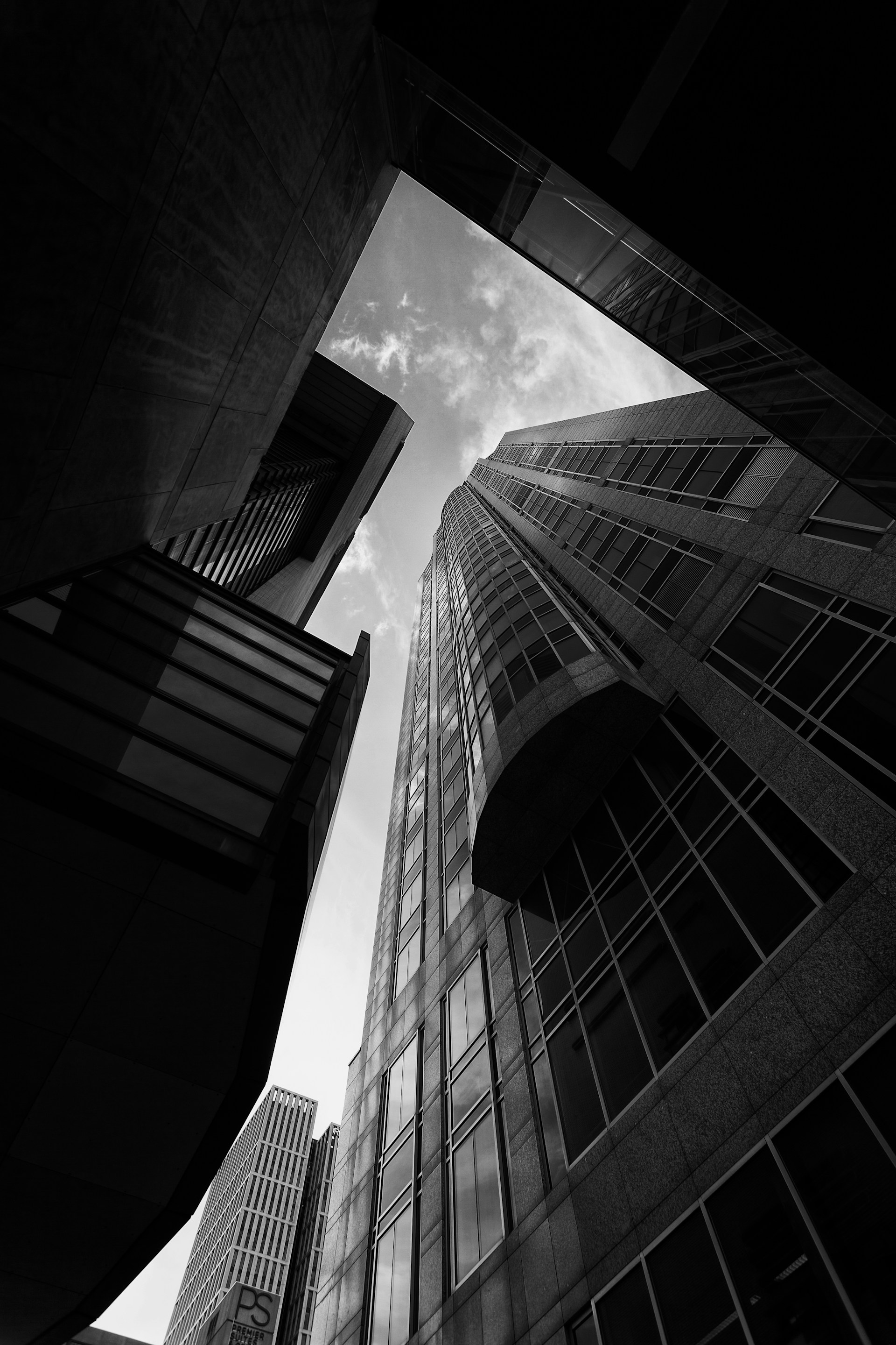 a black and white photo of tall buildings