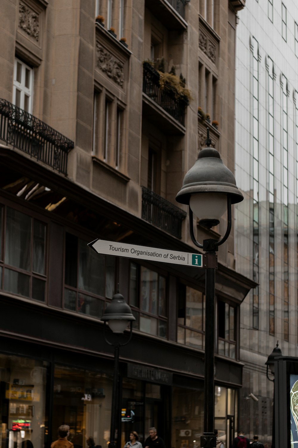 a street sign on a pole in front of a building