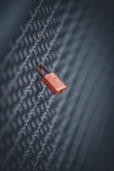 A glowing pink and white lock symbol hinting at exclusive, members-only content.