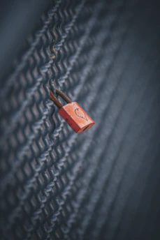 A glowing pink and white lock symbol hinting at exclusive, members-only content.