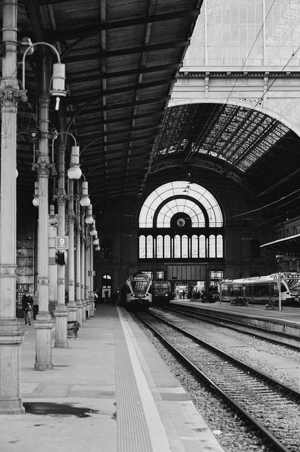 a black and white photo of a train station