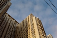 a very tall building with a sky background